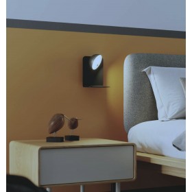 Wall lamp with integrated LED adjustable head and 2A USB input in white or black embossed metal.